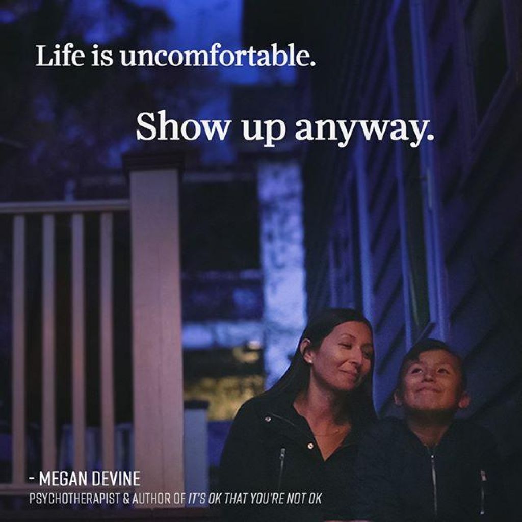 "Life is uncomfortable. Show up anyway." - Megan Devine, psychotherapist and author of It's Ok You're Not OK. Mother and son sitting on outside deck steps looking up into the night sky with slight smiles.